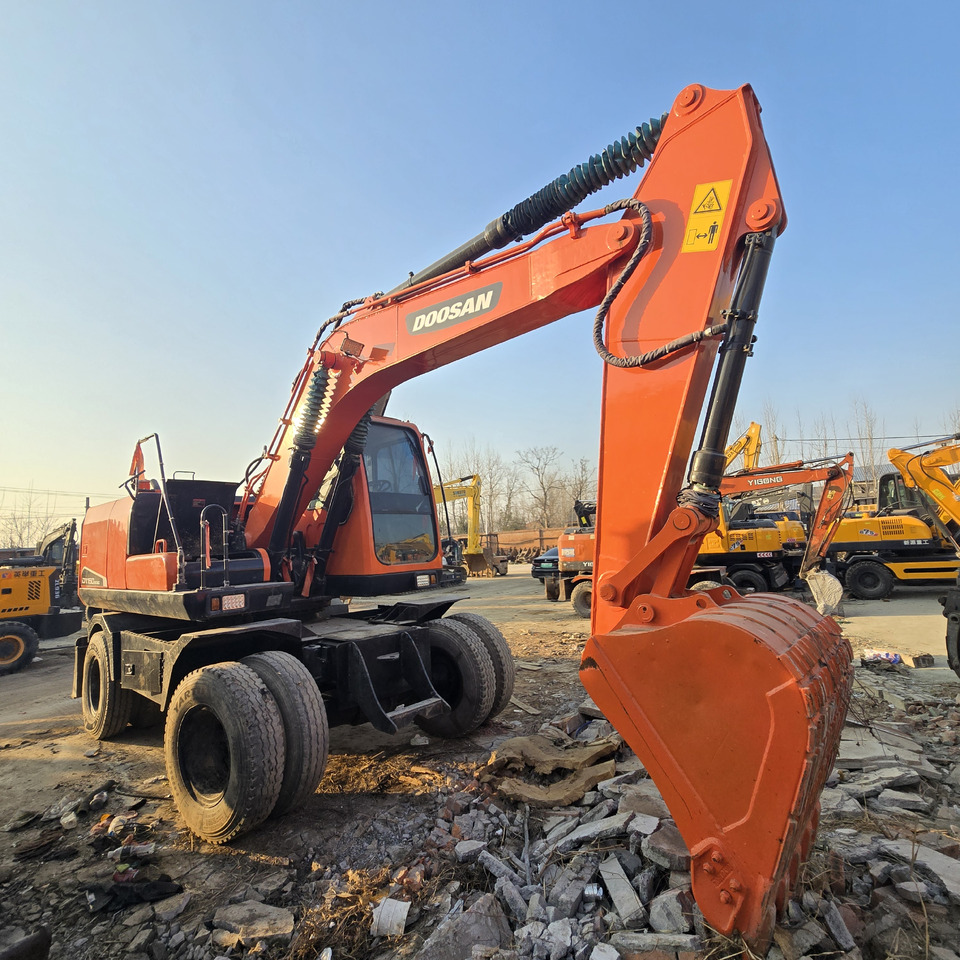 Doosan DX150W-9C - حفارة على عجلات: صور 4 Doosan DX150W-9C - حفارة على عجلات: صور 4