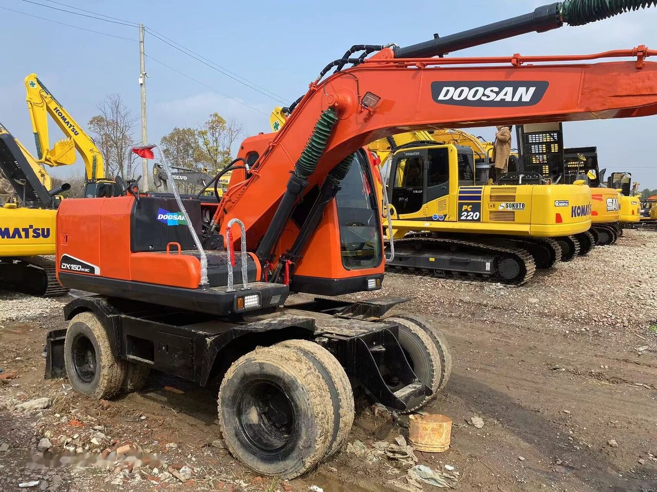 حفارة على عجلات Doosan DX150W: صور 13