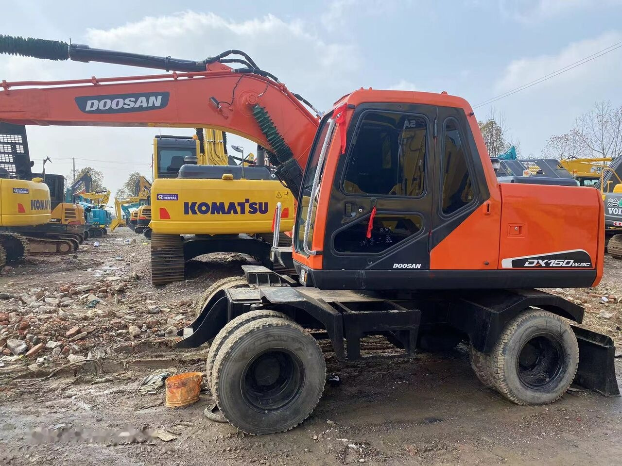حفارة على عجلات Doosan DX150W: صور 11