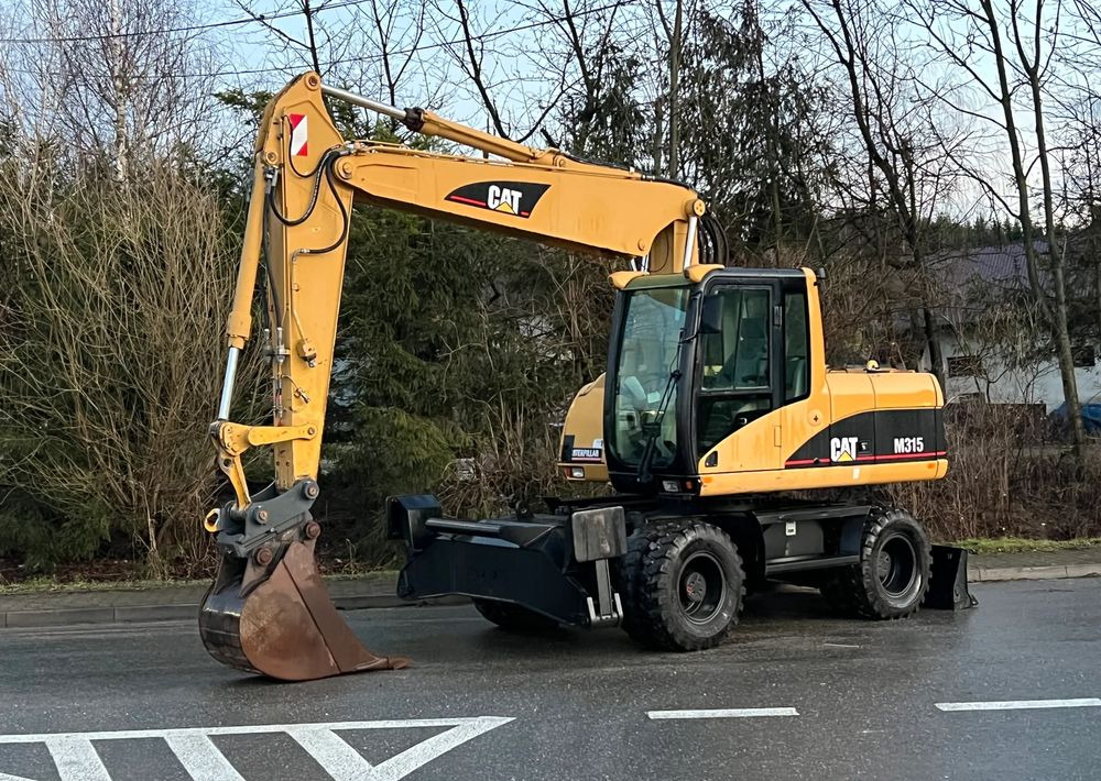 Caterpillar CAT M315C CATERPILLAR SPROWADZONY Bardzo Dobry Stan - حفارة على عجلات: صور 1 Caterpillar CAT M315C CATERPILLAR SPROWADZONY Bardzo Dobry Stan - حفارة على عجلات: صور 1