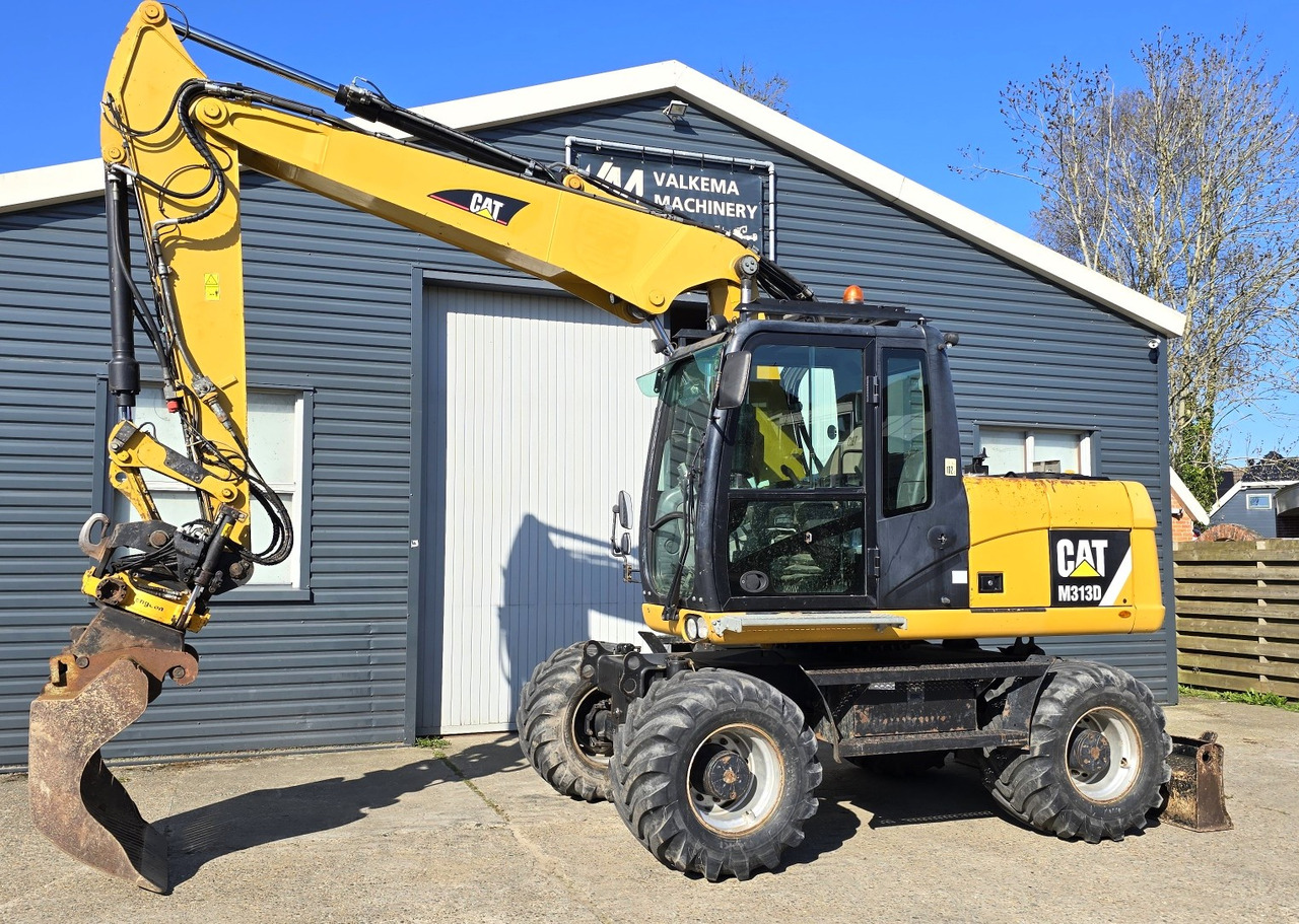 CATERPILLAR M313D - حفارة على عجلات: صور 1 CATERPILLAR M313D - حفارة على عجلات: صور 1