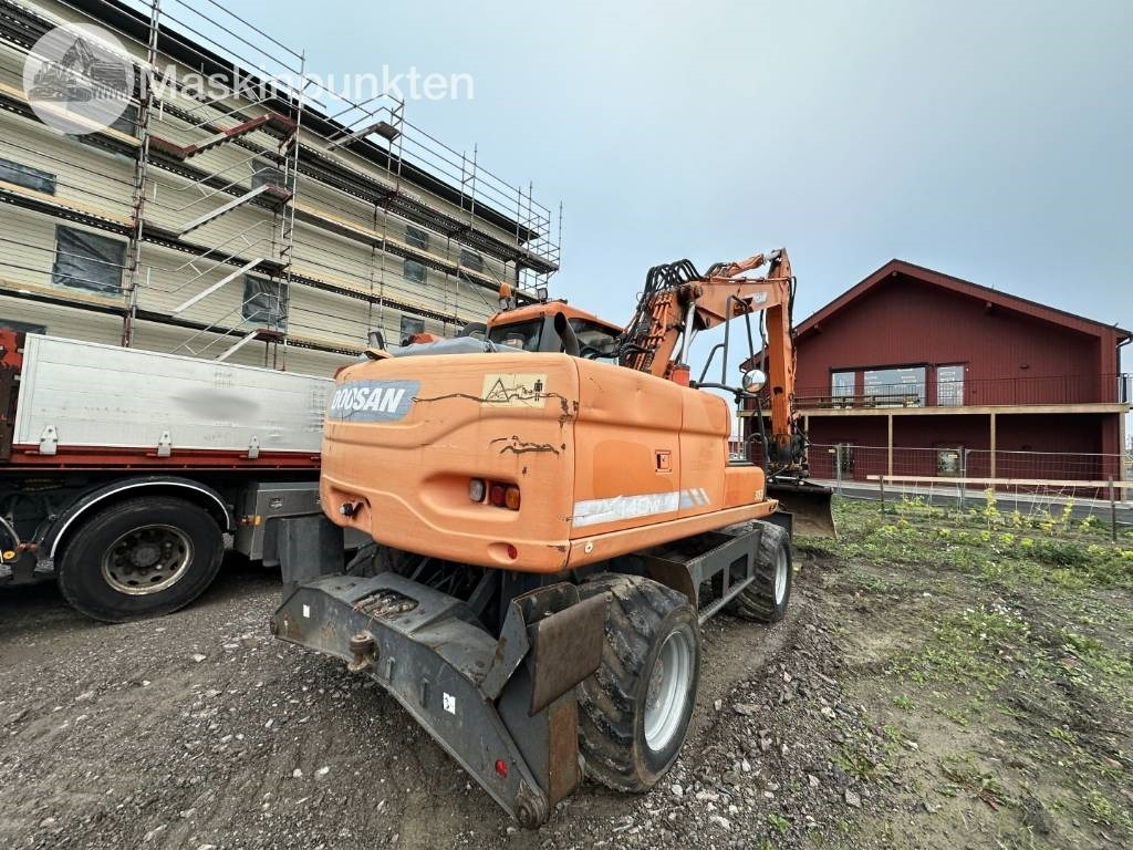 Doosan DX 140 W med vagn och redskap - حفارة على عجلات: صور 4 Doosan DX 140 W med vagn och redskap - حفارة على عجلات: صور 4