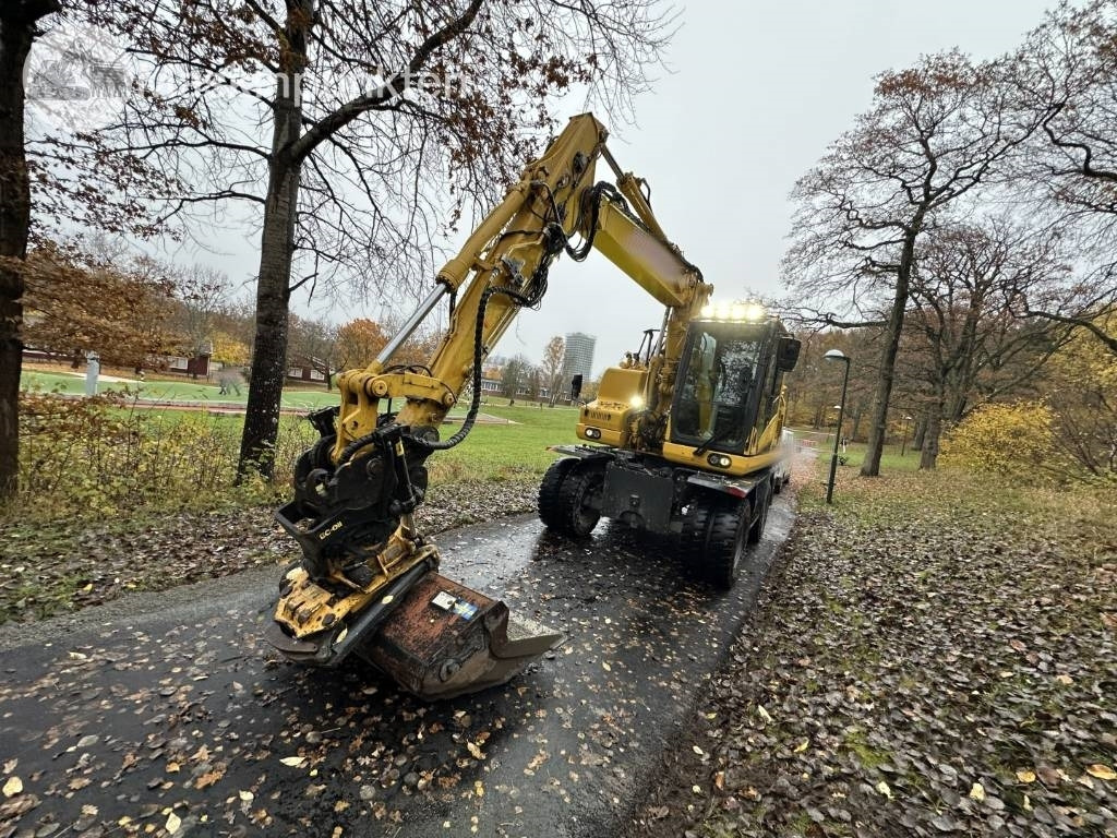 Komatsu PW 148-11 med vagn och redskap - حفارة على عجلات: صور 2 Komatsu PW 148-11 med vagn och redskap - حفارة على عجلات: صور 2
