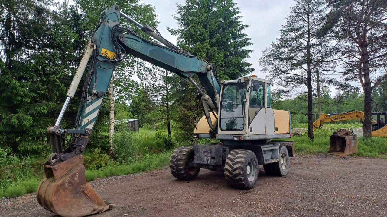 Volvo EW140 - حفارة على عجلات: صور 1 Volvo EW140 - حفارة على عجلات: صور 1