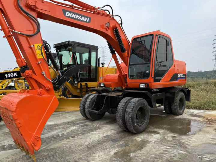 90% Brand New Doosan Brand Dh150w-7 Wheel Excavator in Stock Used Korea Brand Doosan Dh55 Dh60 Dh150 Dh210 Excavator for Sale - حفارة على عجلات: صور 2 90% Brand New Doosan Brand Dh150w-7 Wheel Excavator in Stock Used Korea Brand Doosan Dh55 Dh60 Dh150 Dh210 Excavator for Sale - حفارة على عجلات: صور 2
