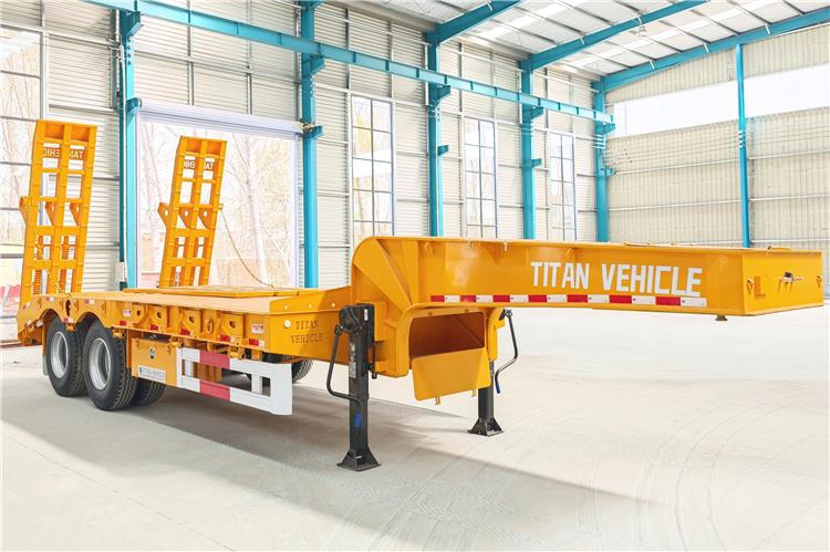 TITAN 2 Axle Low Loader Truck Trailer for Sale In Uganda - عربة مسطحة منخفضة نصف مقطورة: صور 1 TITAN 2 Axle Low Loader Truck Trailer for Sale In Uganda - عربة مسطحة منخفضة نصف مقطورة: صور 1