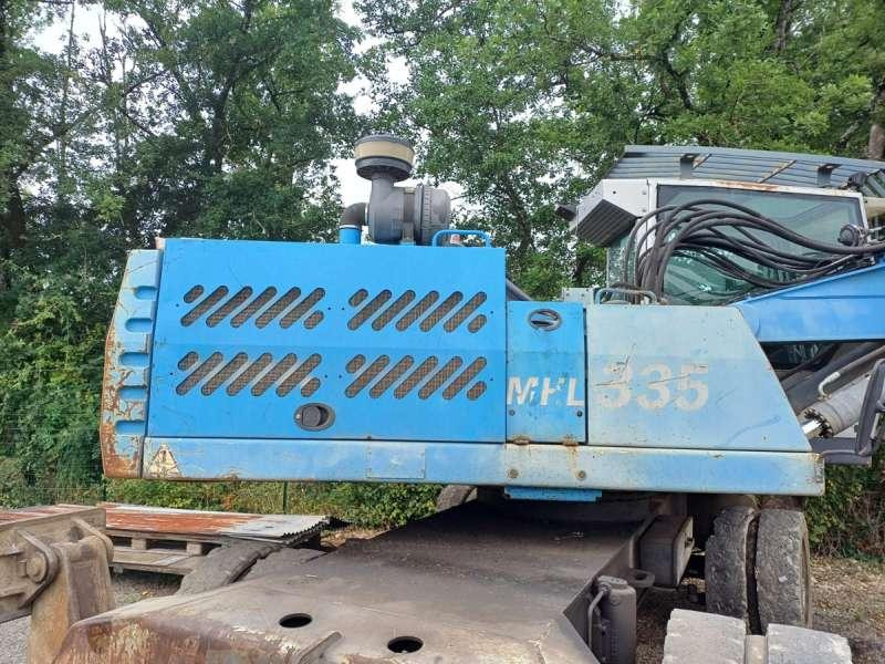 Fuchs MHL335 - حفارة النقل والشحن: صور 5 Fuchs MHL335 - حفارة النقل والشحن: صور 5
