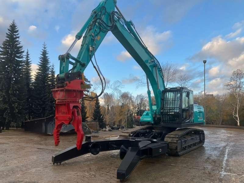 Kobelco SK210LC-10E - حفارة النقل والشحن: صور 2 Kobelco SK210LC-10E - حفارة النقل والشحن: صور 2