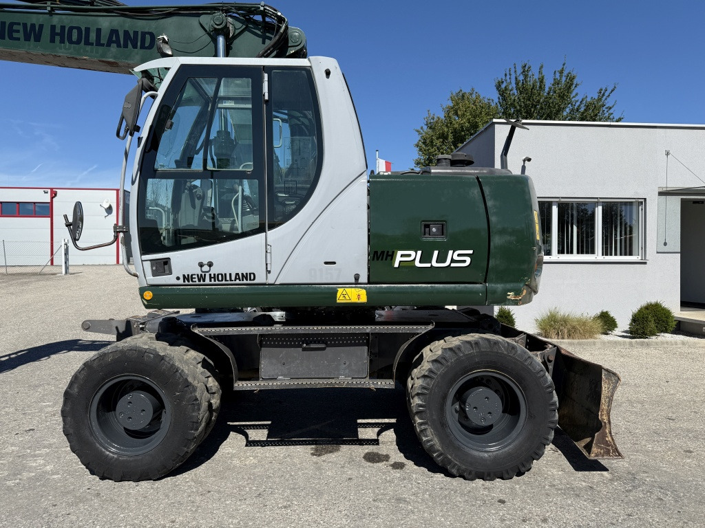 New Holland MH-Plus (111695) - حفارة على عجلات: صور 2 New Holland MH-Plus (111695) - حفارة على عجلات: صور 2