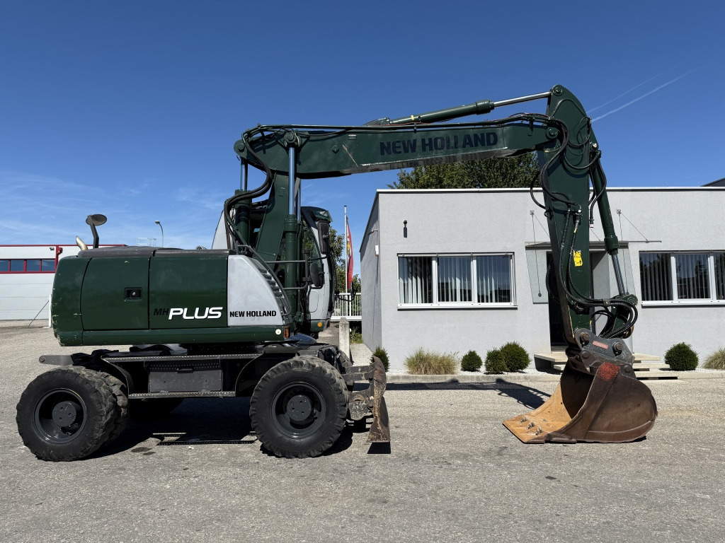 New Holland MH-Plus (111695) - حفارة على عجلات: صور 5 New Holland MH-Plus (111695) - حفارة على عجلات: صور 5