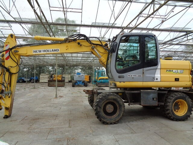 New Holland MH 4.6 - حفارة على عجلات: صور 1 New Holland MH 4.6 - حفارة على عجلات: صور 1