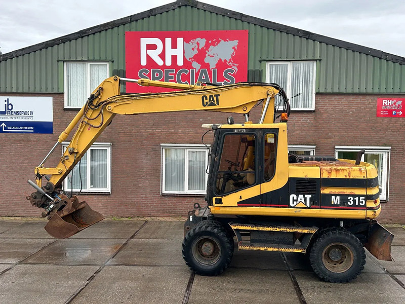Caterpillar M315 +ROTO CE - حفارة على عجلات: صور 1 Caterpillar M315 +ROTO CE - حفارة على عجلات: صور 1