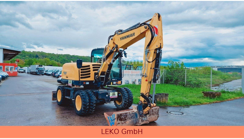 Yanmar B 95W Mit Drei Löffeln und Ein Hammer - حفارة على عجلات: صور 1 Yanmar B 95W Mit Drei Löffeln und Ein Hammer - حفارة على عجلات: صور 1