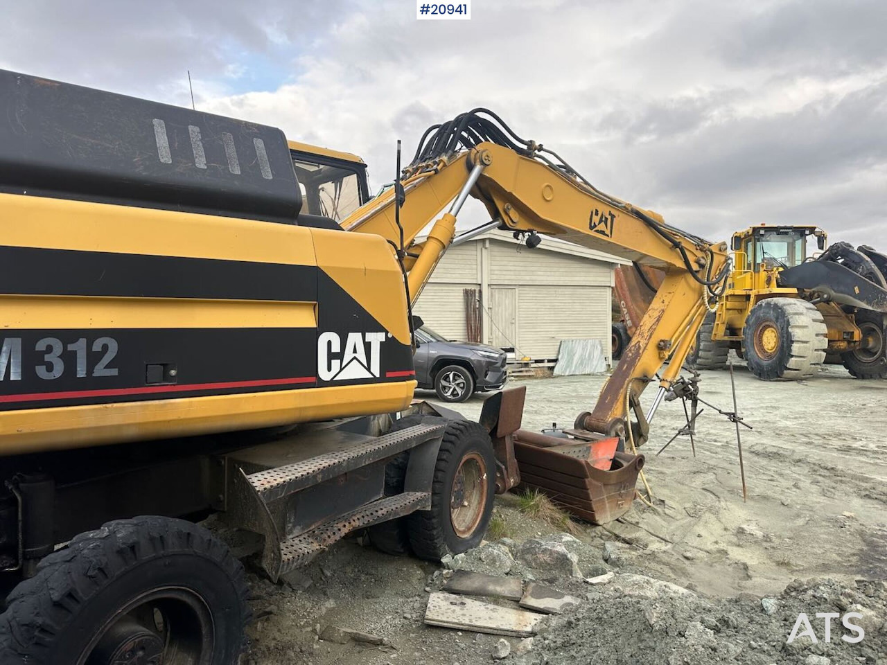 Caterpillar 312 - حفارة على عجلات: صور 4 Caterpillar 312 - حفارة على عجلات: صور 4