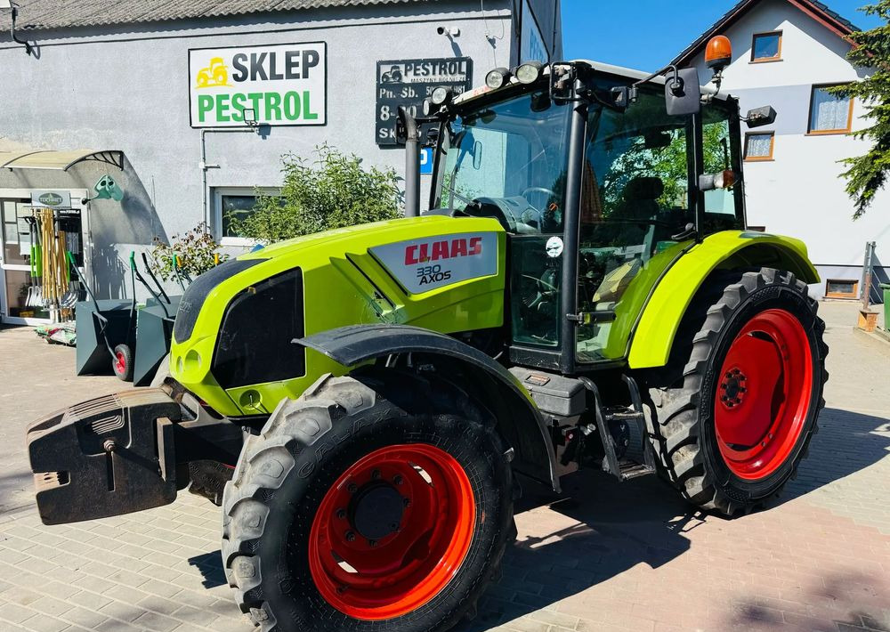 جرار Claas Axos 330: صور 8