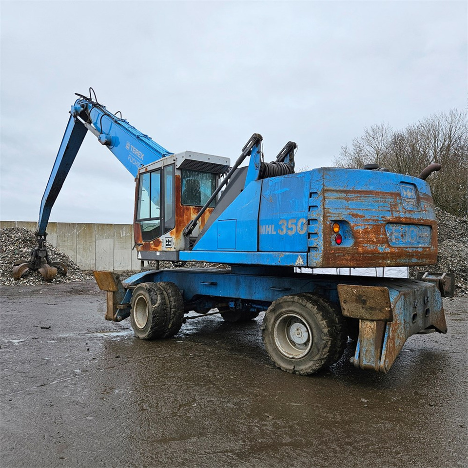 Fuchs MHL 350 D - حفارة النقل والشحن: صور 1 Fuchs MHL 350 D - حفارة النقل والشحن: صور 1