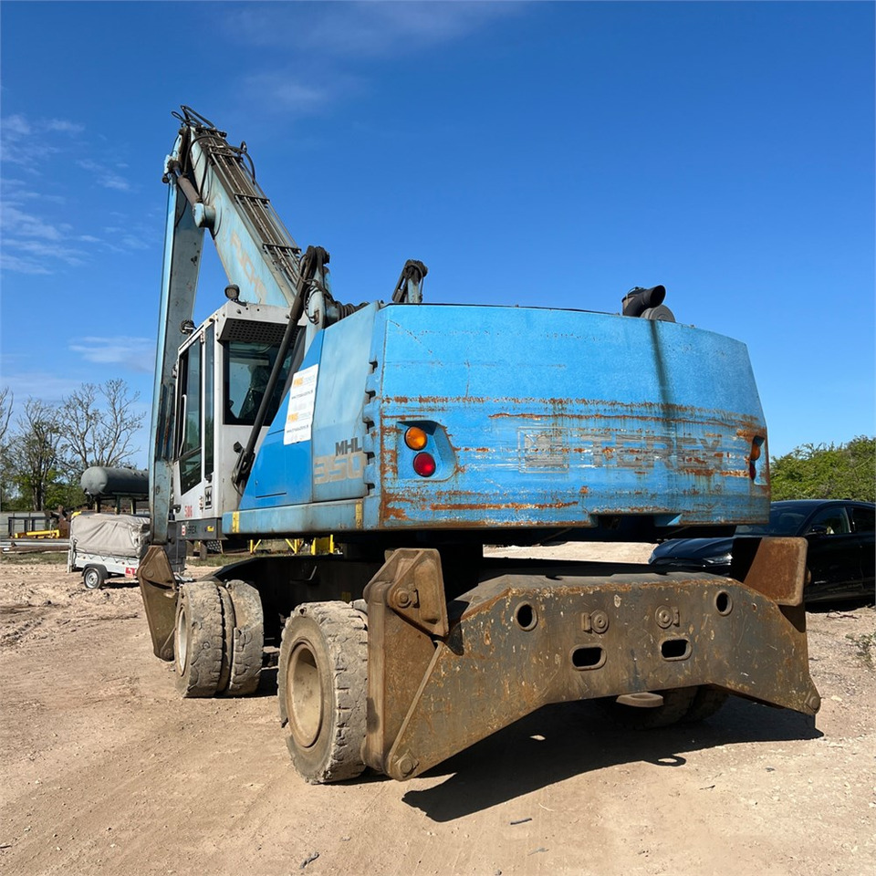Fuchs MHL350 - حفارة النقل والشحن: صور 4 Fuchs MHL350 - حفارة النقل والشحن: صور 4