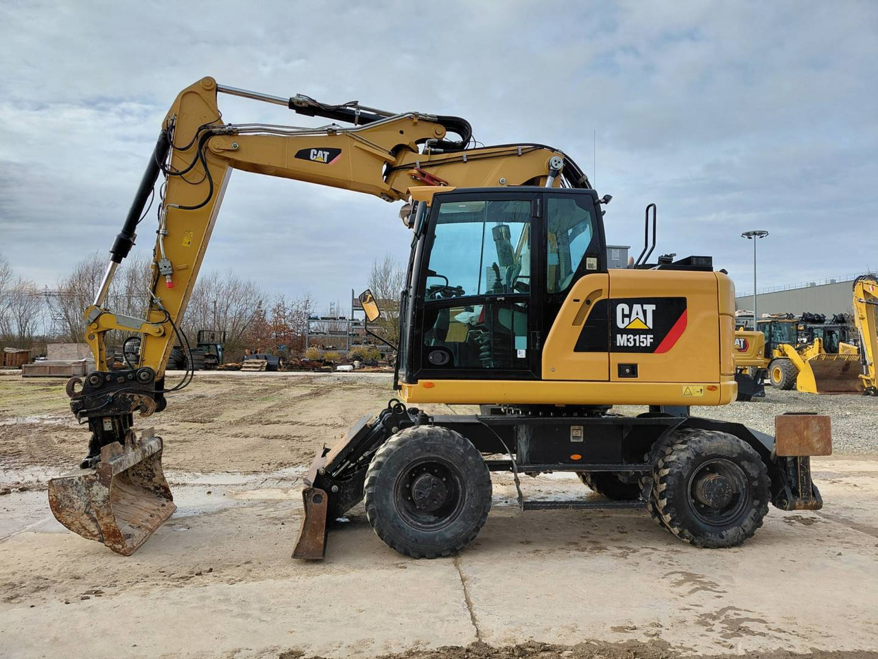 CAT M315F IVC - حفارة على عجلات: صور 1 CAT M315F IVC - حفارة على عجلات: صور 1