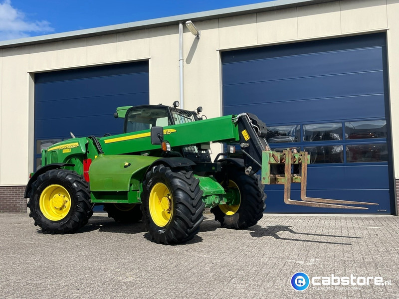 John Deere 3415 Verreiker met vorken en laadschop - الآلات والماكينات الزراعية: صور 1 John Deere 3415 Verreiker met vorken en laadschop - الآلات والماكينات الزراعية: صور 1