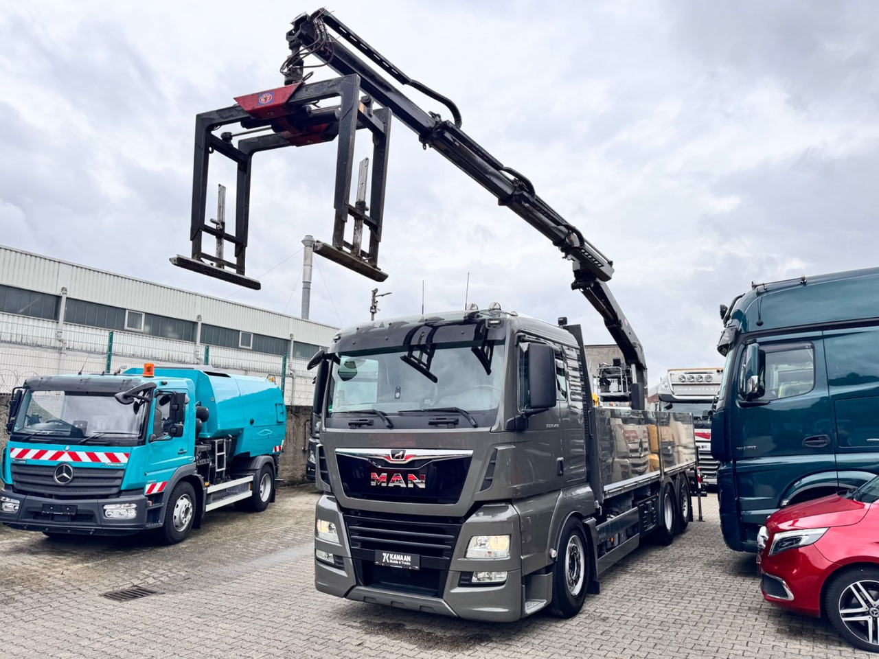 MAN 26.460 TGX Baustoffkran HMF 2110-L3 - شاحنة كرين: صور 4 MAN 26.460 TGX Baustoffkran HMF 2110-L3 - شاحنة كرين: صور 4